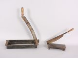 two old tools that are sitting on a table