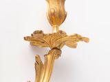 gold leaf wall sconce in the manner of person