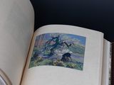 an open book with a picture of a tree on it