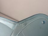 a blue chair that has a glass seat on it