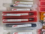 a lot of pens that are sitting in a box
