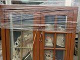 a display case with stuffed animals inside of it