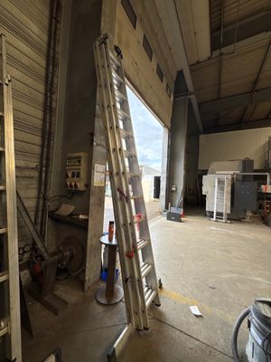 a ladder leaning up against a wall in a building