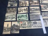 a lot of old black and white photos on the table