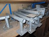 a bunch of metal pipes on a shelf in a room