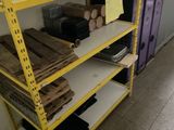 a yellow shelf with a bunch of wood on it