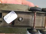 a person holding a toy gun with a tag on it