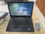 a laptop computer sitting on a table with a mouse next to it
