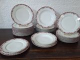 a lot of plates that are sitting on a table
