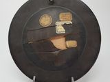 a black plate with a picture of a man and a woman on it