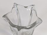 a glass vase that is sitting on a table