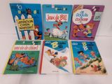 six livres pour enfants en français et en anglais, dont un chien, un chat, un chien, un chat et un chien