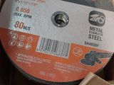 an image of a metal grinding wheel in a cardboard box