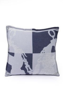 blue and white pillow with a map of the world on it