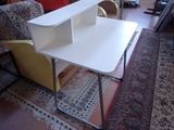 a white desk with a book shelf on top of it