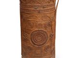 an old wooden box with a handle and a rope
