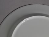 a white plate that has a black and white design on it