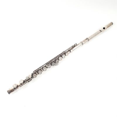 silver flute on a white background with copy space for your text