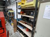 a machine that is sitting in a room with shelves