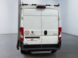 a white van that is parked in a room
