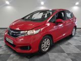 a red honda fit is parked on a checkered floor