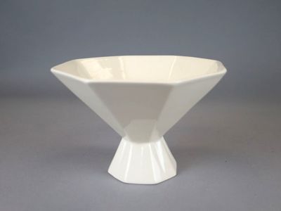a white bowl that is sitting on a table