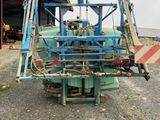 an image of a machine that is parked in front of a building