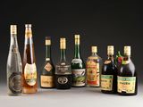 several bottles of alcohol are lined up on a table