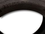 a close up of a tire on a white background