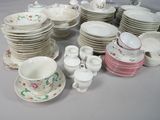 a lot of dishes and cups and saucers on the table