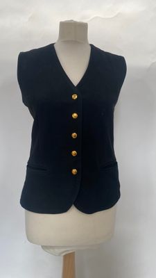 black vest with gold buttons on a mannequin torso