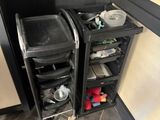 two trash cans that are next to each other in the kitchen