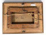 an old wooden picture frame with a rope hanging from it ' s sides