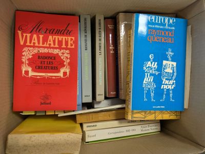 many books that are in a box on the shelf