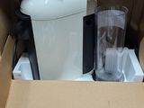 a box with a blender and a cup inside of it