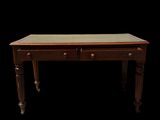 an image of a wooden desk with two drawers and a green top