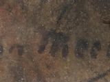 a close up of a sign on the side of a building
