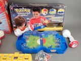 a box of toys and a game on the table