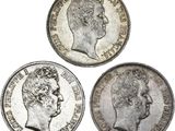 trois pièces d'argent britanniques, dont l'une est un souverain et l'autre est un souverain