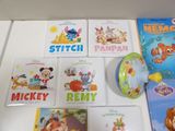 many children ' s books and dvds on the table
