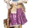a figurine of a woman holding a basket