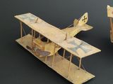 two toy airplanes that are sitting next to each other