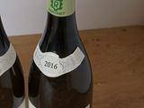 two bottles of wine that are sitting on a table
