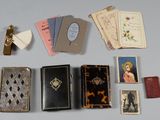 many different types of books and cards laid out on a table