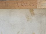graffiti on the wall of a building with a sign that says, ' sorry '