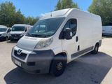 a picture of a white van parked in a parking lot