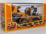 a box with a toy truck inside of it on a table