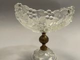 an image of a glass bowl with a wooden base on a white background