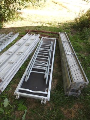 a lot of metal items that are laying out in the grass