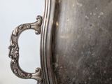 a silver tray that has a handle on it
